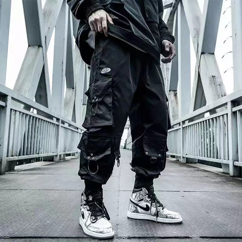 Black oversized cargo pants with multiple pockets, durable streetwear
